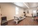 Bright workout room with hardwood floors, pilates machine, stationary bike, and natural light at 995 Chase St, Lakewood, CO 80214