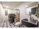 Modern laundry room with sleek appliances, stylish tile flooring, and functional storage options at 995 Chase St, Lakewood, CO 80214