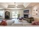 Inviting living room with a fireplace, garden view and access to the outdoor living area at 995 Chase St, Lakewood, CO 80214