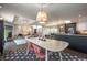 Open concept living and dining areas filled with natural light and modern decor at 995 Chase St, Lakewood, CO 80214