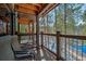 Relaxing balcony view with seating overlooking community pool and trees at 820 Columbine Rd # 10, Breckenridge, CO 80424