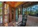 Relaxing outdoor seating on a wooden balcony with a view at 820 Columbine Rd # 10, Breckenridge, CO 80424