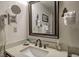 Elegant bathroom with a marble countertop, dark faucet, and a well-lit mirror at 820 Columbine Rd # 10, Breckenridge, CO 80424