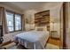 Bedroom featuring a queen sized bed, a wood accent wall, and a closet at 820 Columbine Rd # 10, Breckenridge, CO 80424