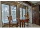 Cozy dining area features natural light, tile flooring, and wood furniture at 820 Columbine Rd # 10, Breckenridge, CO 80424