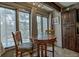 Cozy dining area features natural light, tile flooring, and wood furniture at 820 Columbine Rd # 10, Breckenridge, CO 80424