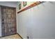 Welcoming entryway featuring a solid wood door, tile floor, and convenient coat rack on the wall at 820 Columbine Rd # 10, Breckenridge, CO 80424