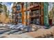 Attractive exterior of a multi-story condo unit featuring balconies and natural landscaping in a serene setting at 820 Columbine Rd # 10, Breckenridge, CO 80424