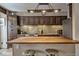 Kitchen with wooden cabinets, stainless steel appliances, and counter seating at 820 Columbine Rd # 10, Breckenridge, CO 80424