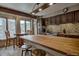 Open kitchen with wooden cabinets, stainless steel appliances, large windows and counter seating at 820 Columbine Rd # 10, Breckenridge, CO 80424