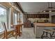 Open kitchen with wooden cabinets, stainless steel appliances and counter seating at 820 Columbine Rd # 10, Breckenridge, CO 80424