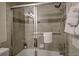 Tiled shower with glass door and white towels at 820 Columbine Rd # 10, Breckenridge, CO 80424