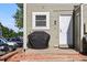 A small patio space in the backyard with a grill and the back entrance of a townhome at 2291 S Jasper Way # B, Aurora, CO 80013