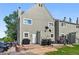 Exterior of a home with a small porch and grill; parking area and small patch of grass beyond at 2291 S Jasper Way # B, Aurora, CO 80013