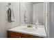 Close up of bathroom vanity with wood cabinets, white countertop, and a decorative gold faucet at 2291 S Jasper Way # B, Aurora, CO 80013