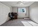 Sunlit bedroom features a desk, chair, and a window, offering a bright and comfortable living space at 2291 S Jasper Way # B, Aurora, CO 80013