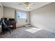 Comfortable bedroom with a ceiling fan, desk, chair, and natural light, offering a pleasant living environment at 2291 S Jasper Way # B, Aurora, CO 80013