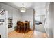 Dining area with hardwood floors, table, and view into living area at 2291 S Jasper Way # B, Aurora, CO 80013