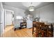Dining room with wood table and chairs near kitchen appliances at 2291 S Jasper Way # B, Aurora, CO 80013