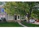 Charming townhome with a well-maintained lawn and mature tree in front at 2291 S Jasper Way # B, Aurora, CO 80013