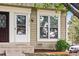 Close-up of townhome exterior showing entrance with white door and window at 2291 S Jasper Way # B, Aurora, CO 80013