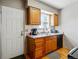 Charming kitchen features wood cabinets, granite countertops and stainless steel appliances, creating an inviting space at 2291 S Jasper Way # B, Aurora, CO 80013