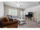 Inviting living room with comfortable seating and natural light from window at 2291 S Jasper Way # B, Aurora, CO 80013