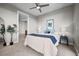 Cozy bedroom with a ceiling fan, art, and a view of a doorway to another room at 4200 W 17Th Ave # 621, Denver, CO 80204