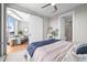 Bedroom with an open view of the living room and attached bathroom with a glass shower at 4200 W 17Th Ave # 621, Denver, CO 80204