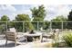 Outdoor lounge area with a modern fire pit and comfortable seating with beautiful views at 4200 W 17Th Ave # 621, Denver, CO 80204