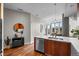 Bright kitchen with white countertops, wooden cabinetry and stainless steel appliances at 4200 W 17Th Ave # 621, Denver, CO 80204