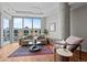 Bright living room featuring hardwood floors, large windows, and modern decor with a view at 4200 W 17Th Ave # 621, Denver, CO 80204