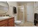 Stylish bathroom boasting a large vanity with a granite countertop and a glass-enclosed shower at 3401 S Glencoe St, Denver, CO 80222