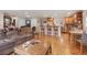 Bright, open living space with hardwood floors, comfortable seating, and an entertainment area at 3401 S Glencoe St, Denver, CO 80222