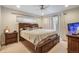 Spacious main bedroom with a ceiling fan, lots of natural light, and ample closet space at 3401 S Glencoe St, Denver, CO 80222
