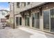 Backyard patio with string lights and multiple sliding glass doors at 15525 W La Salle Ave, Lakewood, CO 80228