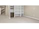 Finished basement with built-in shelving and a wine fridge, perfect for entertaining guests at 15525 W La Salle Ave, Lakewood, CO 80228