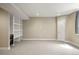 Finished basement with built-in shelving and a wine fridge, perfect for entertaining guests at 15525 W La Salle Ave, Lakewood, CO 80228