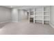 Finished basement featuring built in shelving, wine cooler and neutral walls at 15525 W La Salle Ave, Lakewood, CO 80228