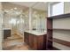 Modern bathroom features a vanity and a glass shower with dual shower heads and a built in shelf at 15525 W La Salle Ave, Lakewood, CO 80228