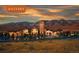 Community exterior at dusk showcasing beautiful architecture, lush landscaping, and warm lighting at 15525 W La Salle Ave, Lakewood, CO 80228