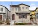 Charming two-story home with an inviting facade, including a covered entry and beautifully landscaped front yard at 15525 W La Salle Ave, Lakewood, CO 80228