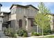 Charming two-story home with neutral stucco exterior and landscaped front yard at 15525 W La Salle Ave, Lakewood, CO 80228