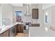 Modern kitchen features stainless steel appliances, sleek countertops, contemporary cabinets, and ample natural light at 15525 W La Salle Ave, Lakewood, CO 80228