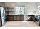 Well-equipped kitchen with stainless appliances, granite countertops, and custom cabinets at 15525 W La Salle Ave, Lakewood, CO 80228