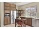 Modern kitchen featuring stainless steel appliances, beautiful cabinetry, and an island perfect for food preparation at 15525 W La Salle Ave, Lakewood, CO 80228