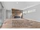 Vacant living room showcases wood accent wall and provides furniture configuration options for a buyer to stage at 15525 W La Salle Ave, Lakewood, CO 80228