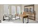 Bright office space featuring modern furniture, large windows, and artwork at 15525 W La Salle Ave, Lakewood, CO 80228