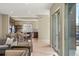 Spacious open floorplan with a view of dining room, hardwood floors, and access to the outdoors at 15525 W La Salle Ave, Lakewood, CO 80228
