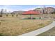 Community park featuring a picnic shelter with tables, set against a scenic landscape with hills and residential buildings at 15525 W La Salle Ave, Lakewood, CO 80228